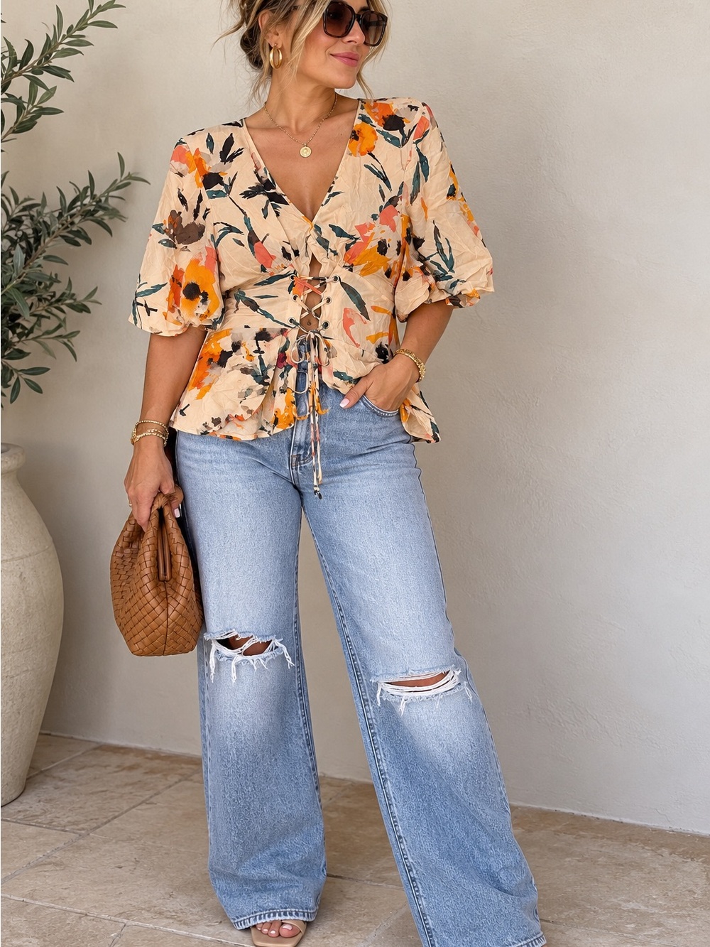 B08. BCBGeneration Cream Floral Lace-Up Peplum Blouse